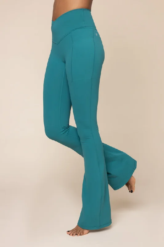 Women's Evening Garments Crisscross Hourglass® Flared Leggings with Pockets - Emerald Women's Evening Garments Crisscross Hourglass® Flared Leggings with Pockets - Emerald